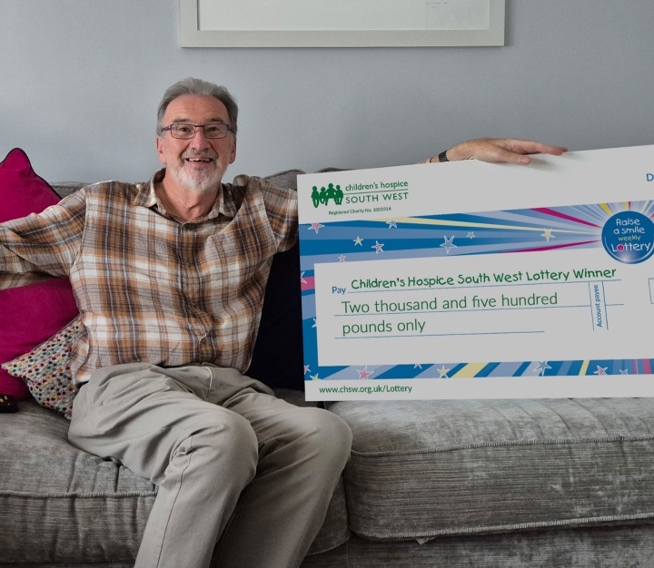 Lottery winner with prize cheque