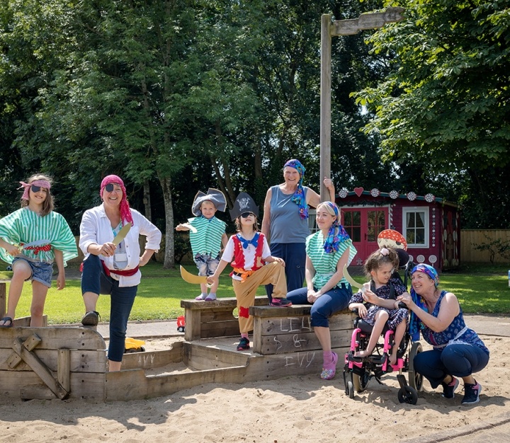 Group of adults and children outside dressed up as pirates