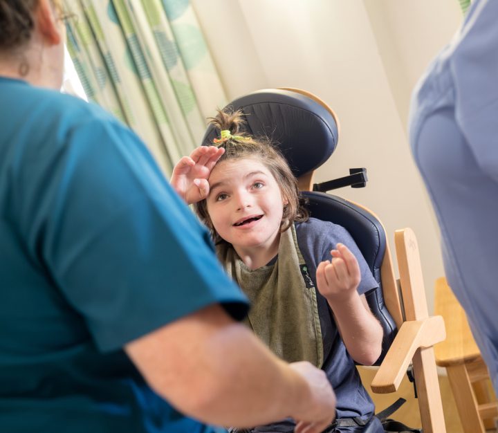 Girl smiling with carers