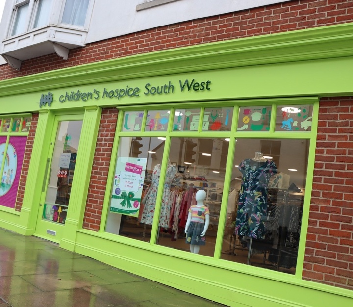 Shop front with bright green signs
