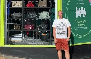 Volunteer outside the Brixham shop