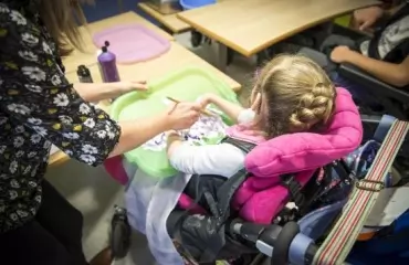 girl painting messy play art